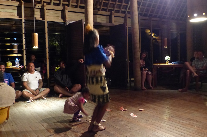 A dancer gets assistance with her cash at Fafa Island Resort